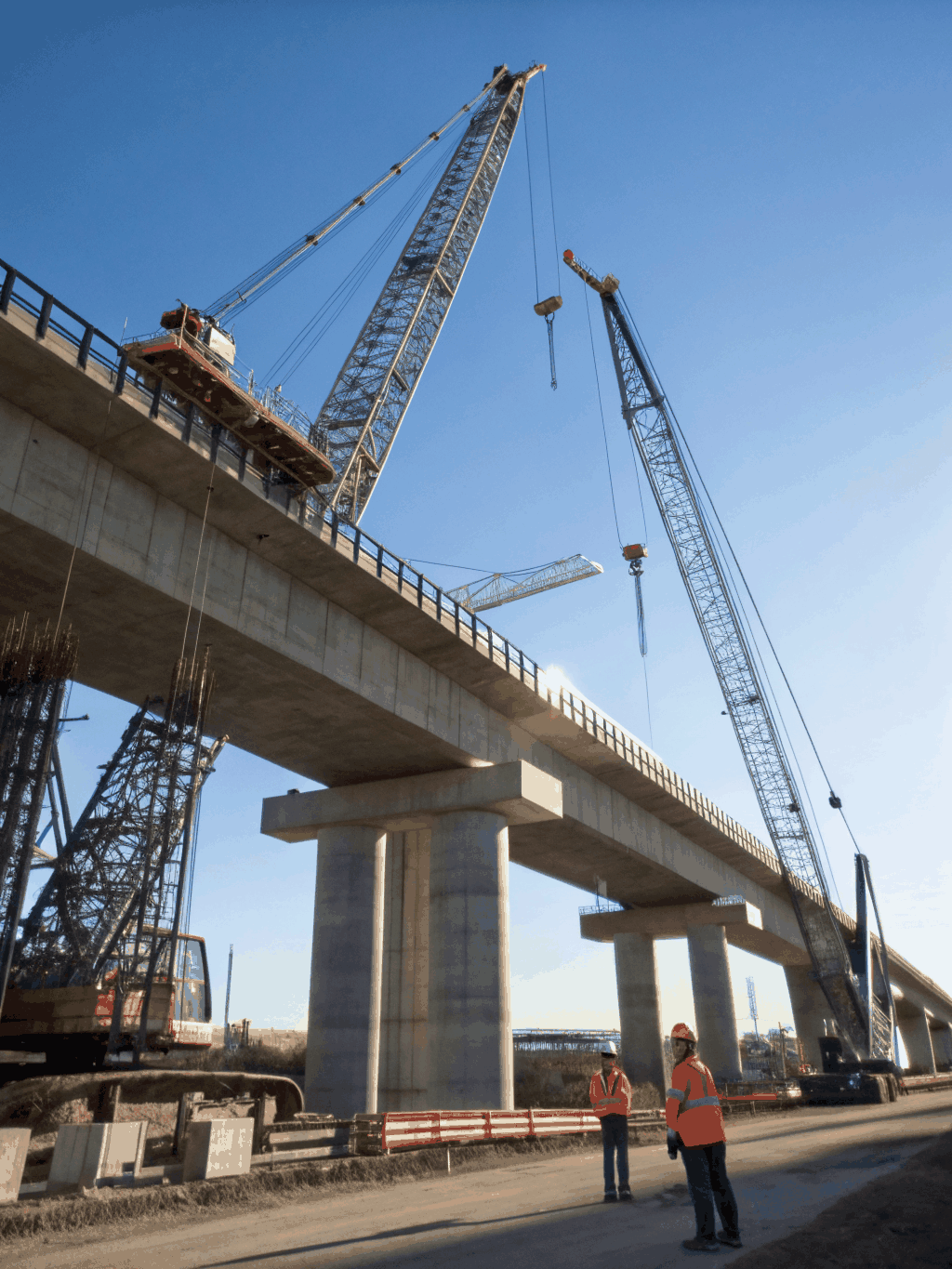 Modern bridge construction site with engineering team